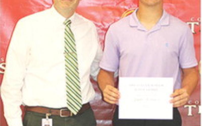 Senior Jayden Rodriguez received the Evelyn Waugh Scholarship from her grandson, Aaron Rider, USD 493 Principal. The $300 scholarship was presented at the May 15 Senior Assembly in the CUHS Gym.