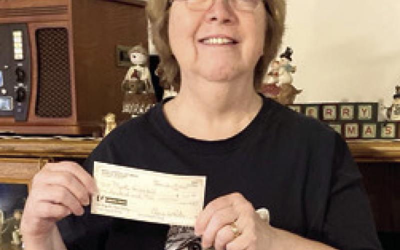 Myrtle VonWedell was the winner of the $100 prized in the drawings sponsored by Columbus Mercy Auxiliary. Winners were drawn at the December 19 meeting. Courtesy photo.