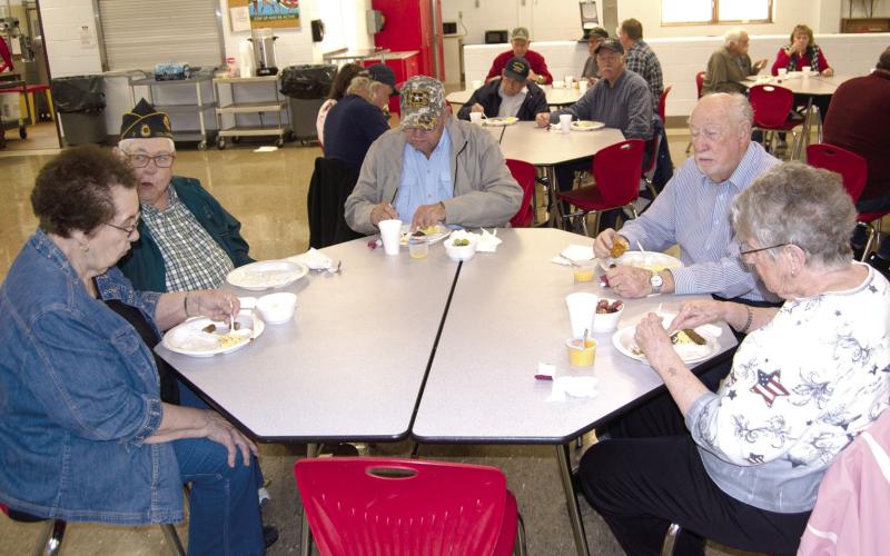 Enjoying breakfast at the CJSHS Veterans Day Assembly were local Veterans Dewey Smith and wife LaDonna, Kenneth Frobish, Pastor Jim Lewis and Marilyn Frobish.