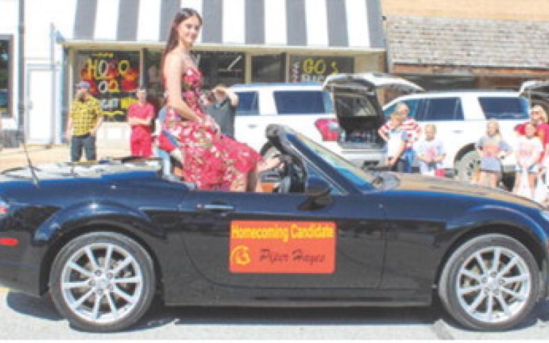 Columbus Unified High School 2025 Homecoming Queen Piper Hayes waved to the crowds during the parade up Maple Street Friday after noon. The crowning took place at half-time of the Neodesha-Columbus football game.