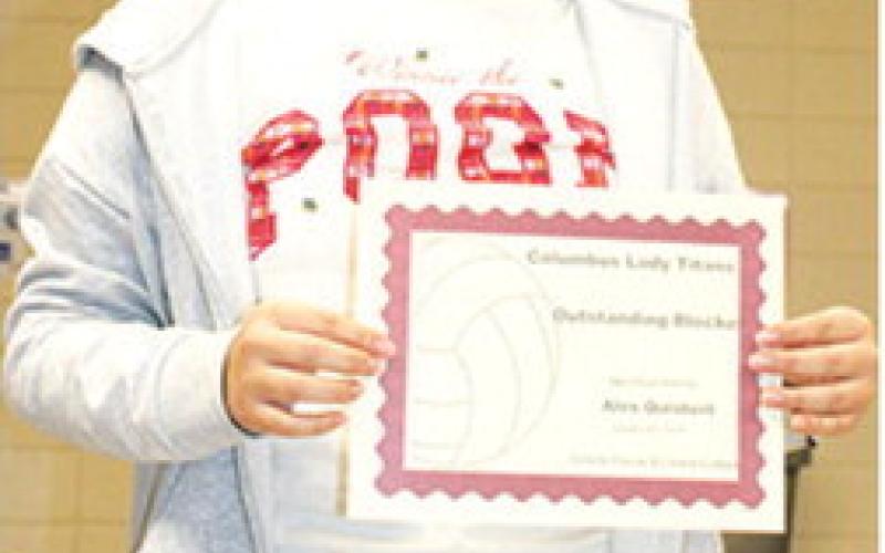 Lady Titan Senior, Alexandra Quisbert, received the award for Outstanding Blocking and Most Improved Award during the Lady Titan Volleyball end of season banquet at the Columbus Unified High School Gymnasium in October.