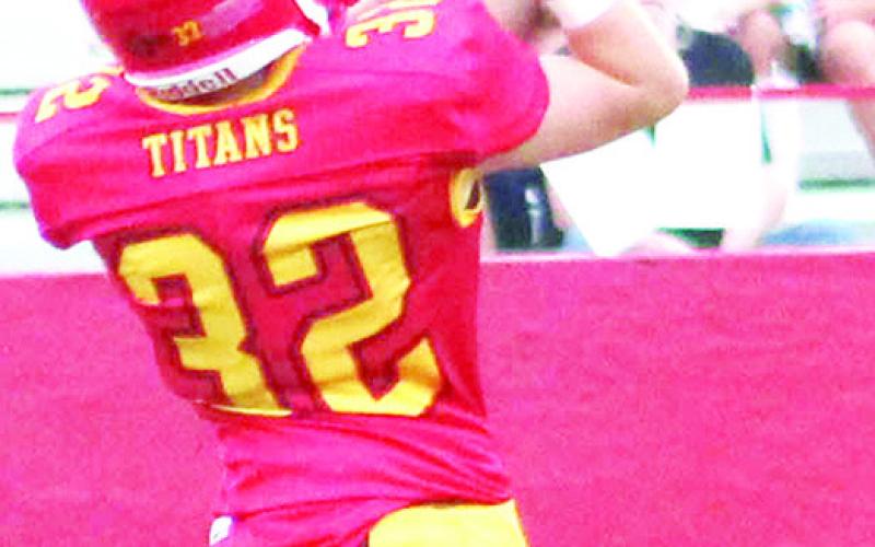 Columbus Junior High Eighth Grader, Paxton Schalk, catches a 16-yard pass from Denver Hughes for the first six Titan points in Thursday’s 46-26 loss to Riverton at Titan Stadium.