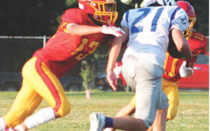 Hayden Kellogg and Cord Saporito, Columbus Titan Eighth Graders had their eye on the St. Mary’s-Colgan running back in the 36-0, Columbus win over the visiting Panthers, Thursday at Titan Stadium. Hayden also had a receiving and a rushing touchdown in the game.