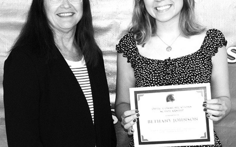 Columbus Unified High School Senior Bethany Johnson was presented a $1000 Columbus Telephone/ Optic Communications scholarship by Jane Rhinehart at the Senior Awards Ceremony, May 17 at the CUHS gymnasium.