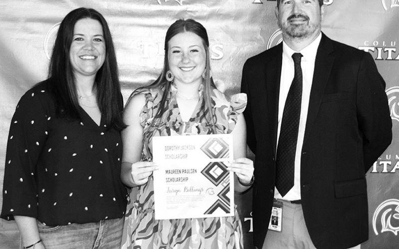CUHS Senior Taryn Billings was presented a $2000 Dorothy Jackson Scholarship and a $500 Maureen Paulsen Scholarship by USD 493 instructor Kelly Walters and Columbus Unified High School Principal Dan Grundy during the CUHS Senior Awards Ceremony, May 17, at the high school gymnasium.