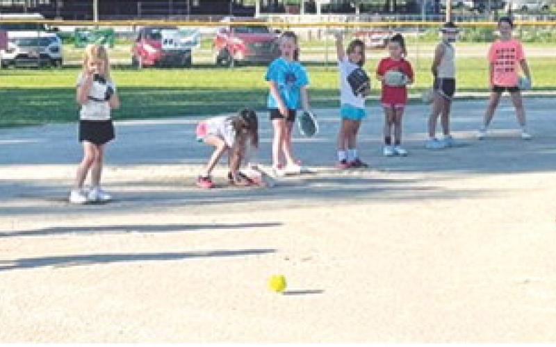 Young softball players learn skills