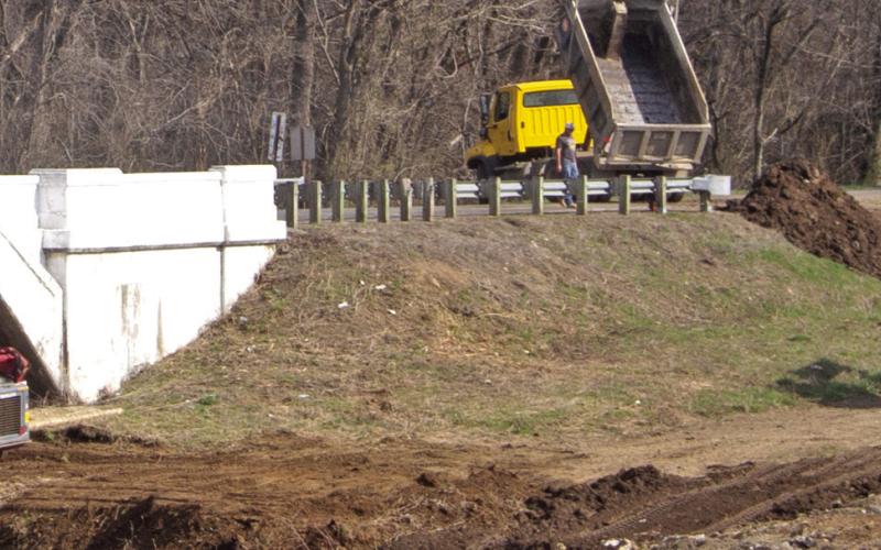 Cherokee County Road Department workers were busy last week clean debris from the area around the Rainbow Bridge outside Baxter Springs. When completed the cleaned area could become a picnic-grounds with tables.