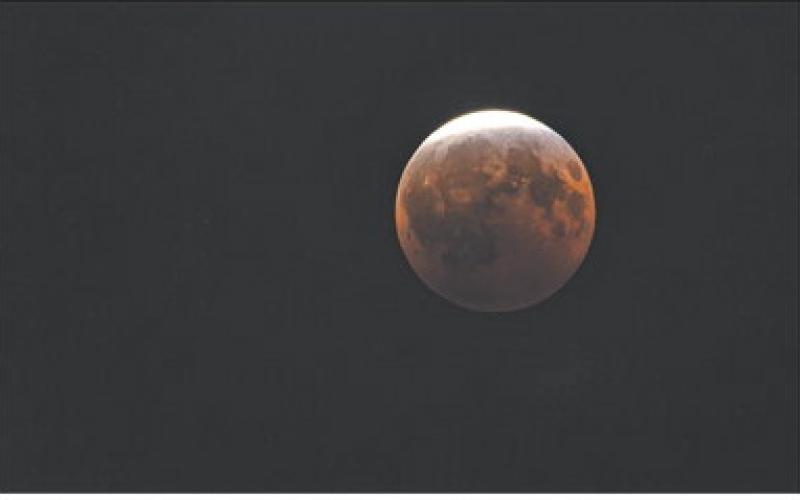 A near total lunar eclipse was visible to Cherokee County residents Thursday, August 27. This photo was taken near the eclipse’ peak at 11:12 p.m. Central Time from the sidewalk along 105 South Pennsylvania Avenue. For nearly three and a half hours the earth cast its shadow across the lunar surface.