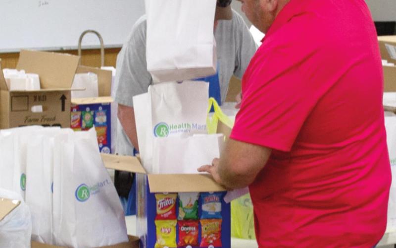 Community turns out for pulled pork lunch benefit