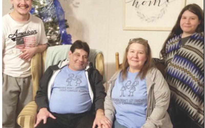 Danny Newcomb (seated, left) and family.
