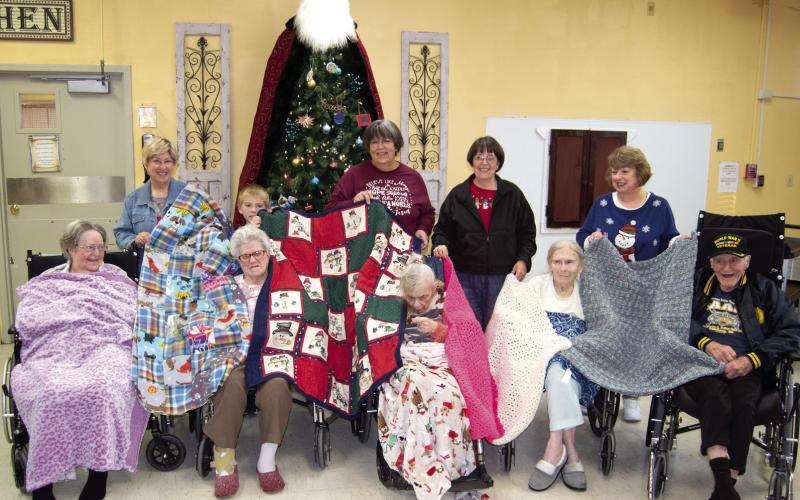 Residents at Medicalodges of Columbus will be a little warmer this year thanks to the Cherokee County Knitting Crocheting and Sewing Group. They provided blankets for the patients at the care facility. The patients accepting the gifts were Sally Saporito, Imy Jones, Jean Swain, Joanna Parsons, Ge Ge Sachetta. Those delivering the handiwork were Cindy Gleason, Jacob Holden, Gina Peak, Joleen Walden and Karen Langerot.