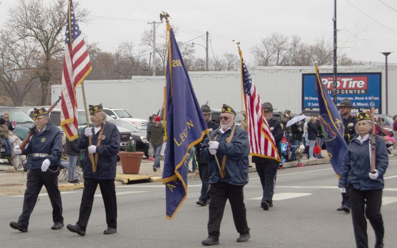 Members of the Baxter Springs American Legion post carried the American and Post Flags at the beginning of the Baxter Springs Christmas parade December 2.