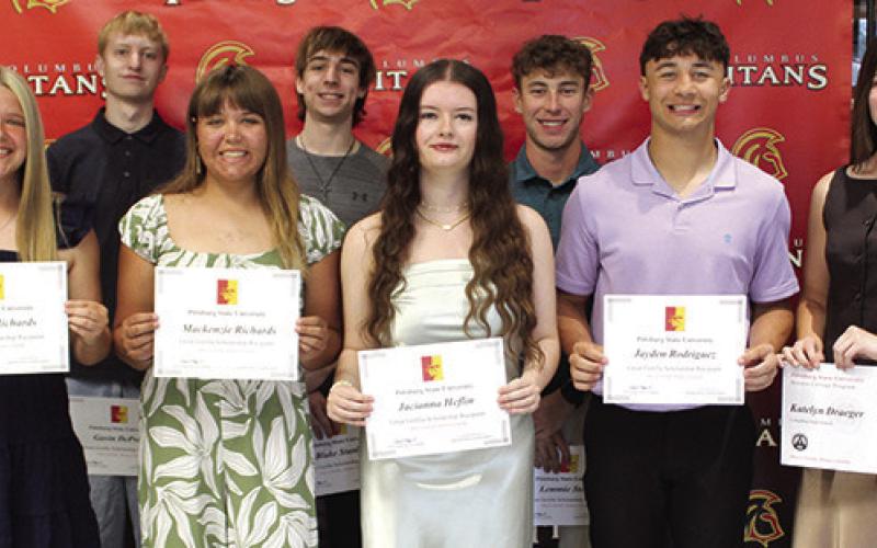Columbus Unified High School Senior Students receiving scholarship awards from Pittsburg State University Representative, Colin Coronado are front row: Morgan Richards, Mackenzie Richards, Jacianna Heflin, Jayden Rodriguez, and Katelyn Draeger. Back row: Gavin DePratt, Blake Stanley, and Lemmie. Scholarships were awarded during the CUHS Senior Assembly, May 15, at the Columbus High School Gymnasium.