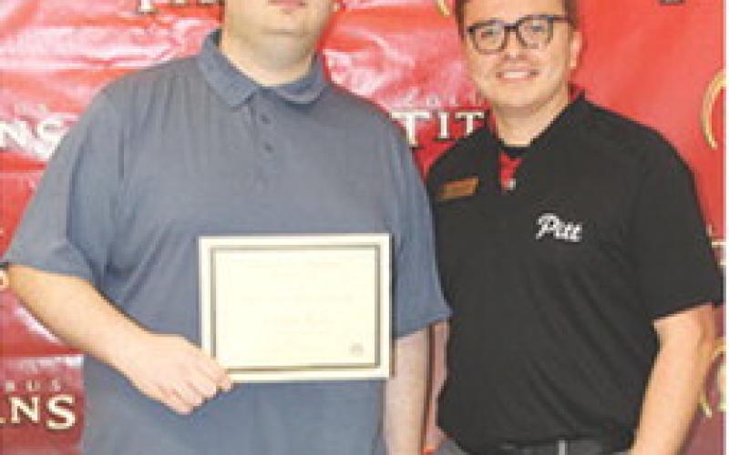 Columbus Unified High School Senior Johnathon Thomas received a $4,000 Great Gorilla Scholarship, a $700 Gibson Brunson Scholarship and the Ron and Hortense Smith Mathematics Scholarship from Pittsburg State University Representative, Colin Coronado during the CUHS Senior Assembly May 15 at the high school gymnasium.