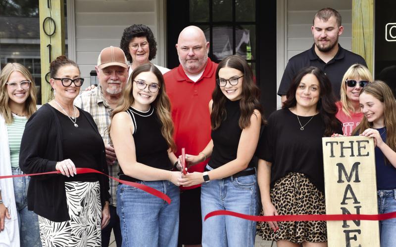 A ribbon cutting and presentation of the first dollar was held at the newest hair salon in Columbus. The Mane Look, was built from the ground up by Columbus High School Alums Hayden and Peyton Allen. They were presented their first dollar (at right) by Rebecca Spooner, Columbus Chamber of Commerce President.