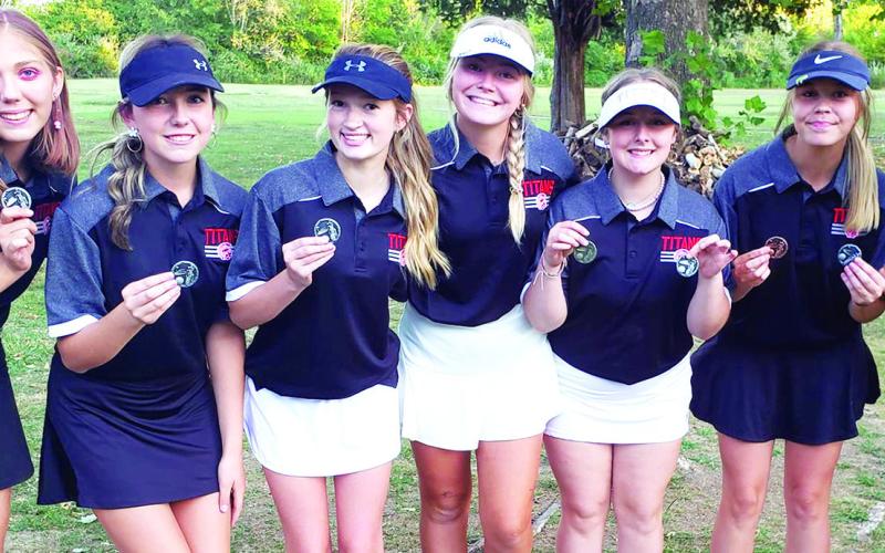 Members of the Lady Titan Varsity and Junior Varsity Golf Teams played a duel tournament at the Country Side Golf Course in Pittsburg, September 26. The varsity squad took second led by Mallory Thompson, sophomore, in first place. Varsity and junior varsity players are: Anna Head, sophomore; Reese Grundy, junior; Paige Patton, freshman; Suzan Crowe, junior; Emily Buffington, freshman; Kenlyn Christiansoen, senior; and Mallory Thompson, sophomore. Courtesy Photo.
