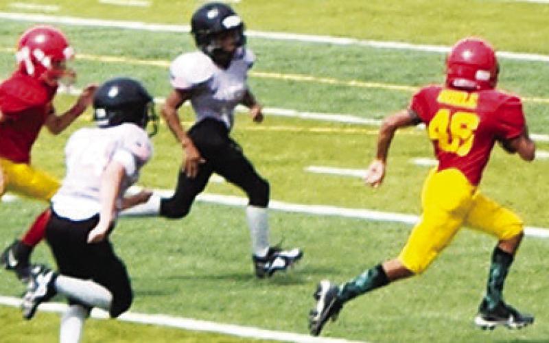 Titan, Jayden Dohle, opened the seventh grade season with a 40-yard touchdown run on the first play, of the first possession of the season in the Titans 30-0 shut out in Independence, Saturday. Jayden also scored the second touchdown on a 15-yard dash. Columbus will host Pittsburg tomorrow. Courtesy Photo.