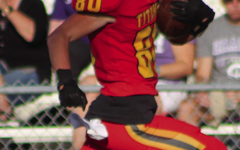 Titan Sophomore, Jace Midgett, runs for a 91-yard pass and run touchdown in the Columbus Junior Varsity loss to Pittsburg, Monday, at Titan Stadium.