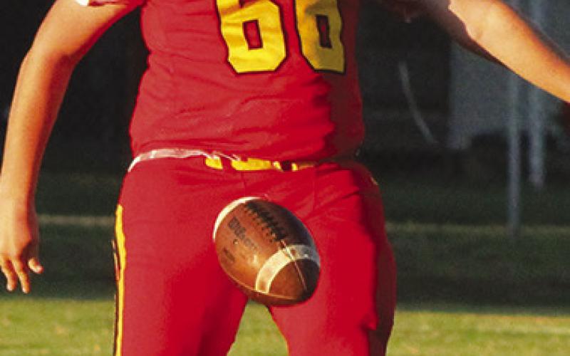Titan Junior, Huck Hallam, punts the ball away during the Columbus Junior Varsity match-up with Pittsburg, Monday night at Titan Stadium. The Titans took and early, 12-0, lead in the first half only to watch it slip away in a 20-12 loss to the SEK League Team. Columbus will host Coffeyville, Monday in a 6 p.m. contest on their home, Cecil Cline Field.