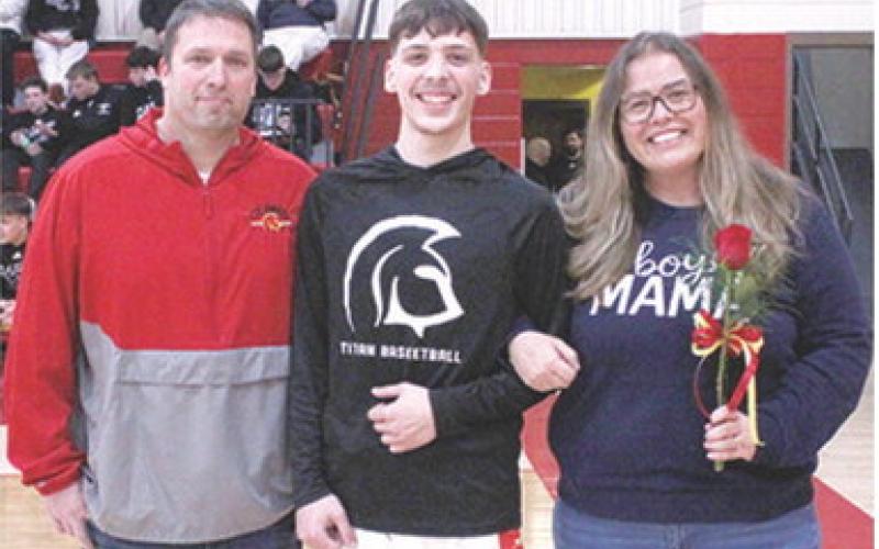 Titan Senior, Julien Basuari, was recognized during Senior Night at the Titans final home game against Frontenac, Monday night at the CUHS Gymnasium. Julien is a one year member of the Titan Basketball Team. He was escorted by his parents Justin and Misty Smith.