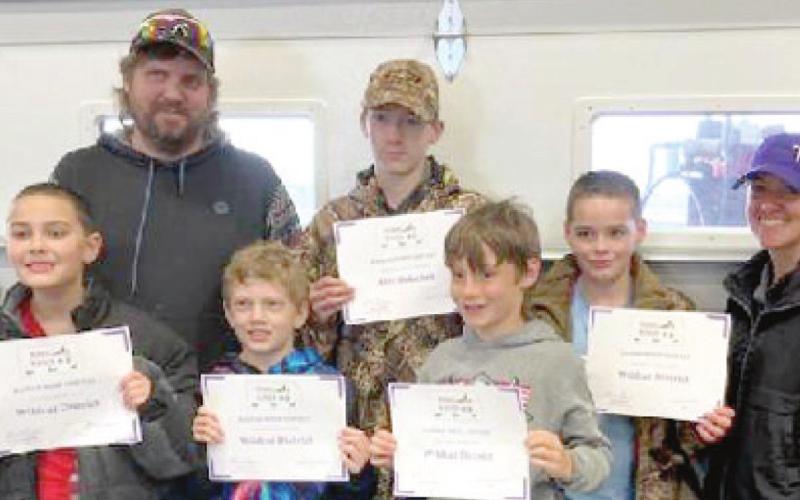 A newly-formed Wildcat District 4-H Wildlife Team recently received second place junior team at the Kansas WHEP (Wildlife Habitat Education Program) Competition at Woodson State Fishing Lake in Toronto. Members include front row: left to right: Brian Longan, Damien Evans, Raylan Elsworth. Back row left to right: Brian Elsworth (coach), Alex Dolechek, Phillip Longan, and Adaven Scronce (coach). Courtesy photo.