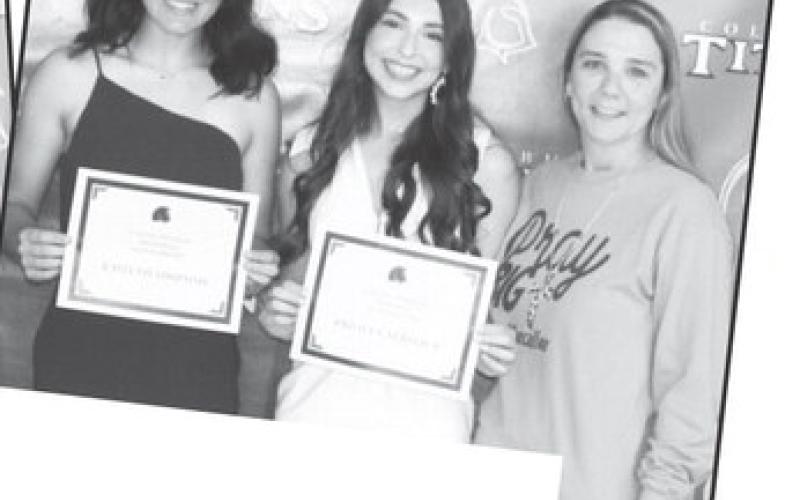 Lady Titan Seniors, Kaitlyn Simpson and Presley Tedlock ( below) received the Callie Hansen Memo-rial Scholarship in the amount of $ 500 each from Lady Titan Volleyball Coach and Hansen Family Friend, Ryan Lacen, during the Senior Awards Ceremony, May 17, at the high school gymnasium.