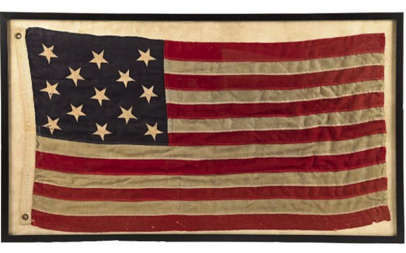 A framed antique American flag features 13 stars, just like the original design approved by the Continental Congress.Photo Credit: Morphy Auctions (c) 2026 by Cowles Syndicate Inc.