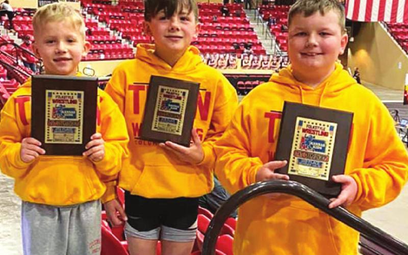 Members of the Columbus Wrestling Club eight and under squad placed in the USAWKS 2021 State Folkstyle Wrestling Championship in Mulvane, Saturday. Baylor Bowman placed fourth in the 8U, 43-pound class, Cam Carter was sixth at 8U, 61-pound class and Cajen Smith placed third in the 8U, 140-pound class. Courtesy Photo.