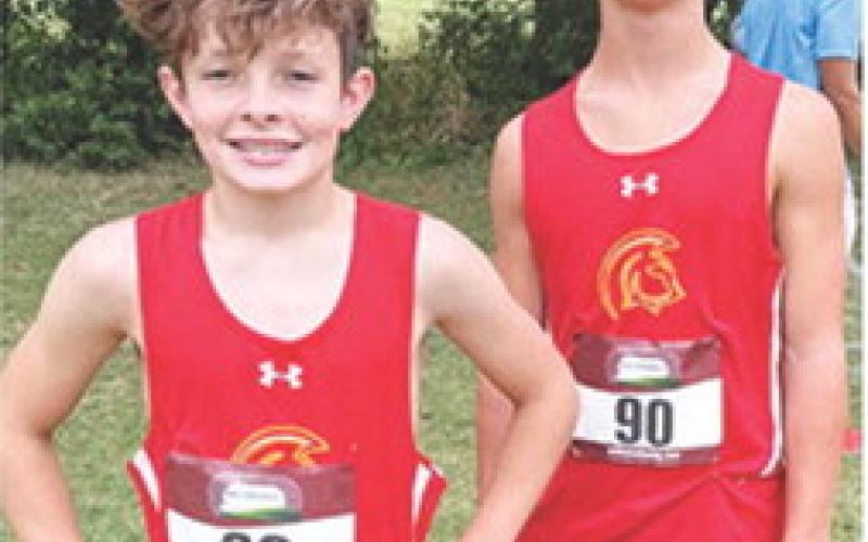 Titan eighth graders Tanner Scott (seventh place) and Eli Engelman (fifth) competed in the Oswego Cross Country Meet, September 18. Courtesy photo.