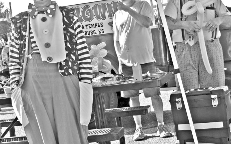 A number of street entertainers were on hand for the Columbus Day Festivities. The Mirza Clowns had a booth making balloon sculptures for adults and children alike. Photo by Neva Hiatt.