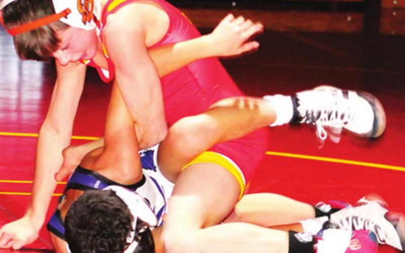 Mini Titans exhibit on varsity mats