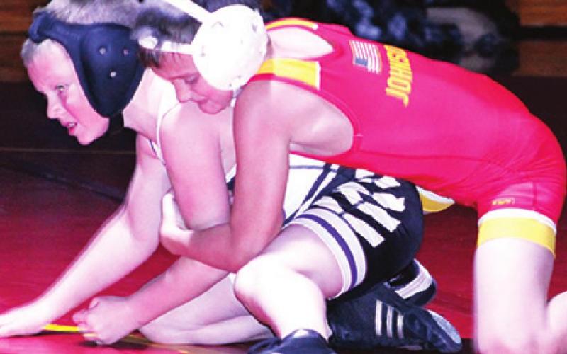 Mini Titans exhibit on varsity mats