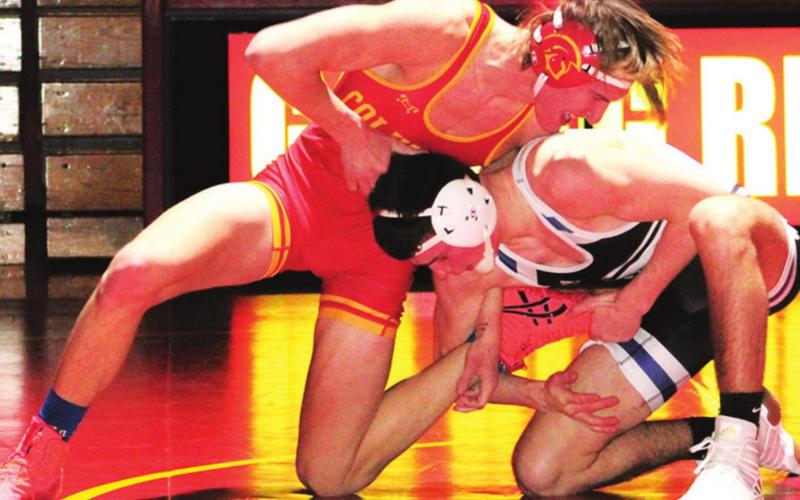 Mini Titans exhibit on varsity mats