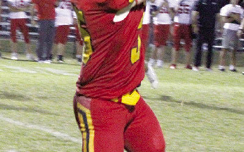 Syler Schuberger, senior, took this pass and catch 30 yards, inside the ten-yard line then punched it in from five yards out for the final touchdown of the 62-30 homecoming win over Baxter Springs, Friday, at Titan Stadium. Sy had five rushes for 100 yards, three receptions for 42 yards, and four solo tackles.