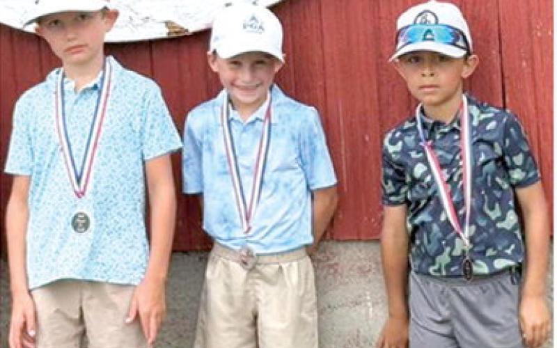 Displaying their skills from the Columbus Junior Golf Camp the week before, Hollis Havercamp, Jack Koons, and Parker Dainty brought home second, third, and fourth place medals respectively from the Oswego Invitational Junior Golf Tournament, June 4, at the Oswego Golf Course. Courtesy photo.
