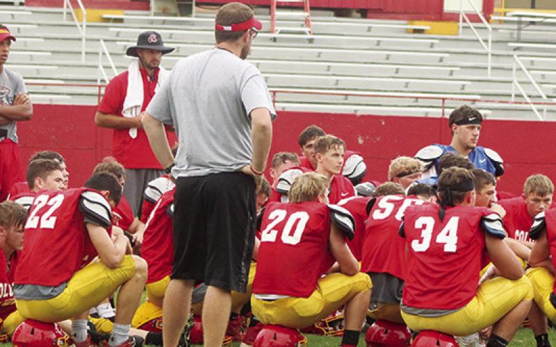Titan Head Coach Blake Burns addresses the team following the annual Lawn Chair Scrimmage at Titan Stadium, Saturday. Columbus opens the regular season schedule, September 2, at home against Girard.