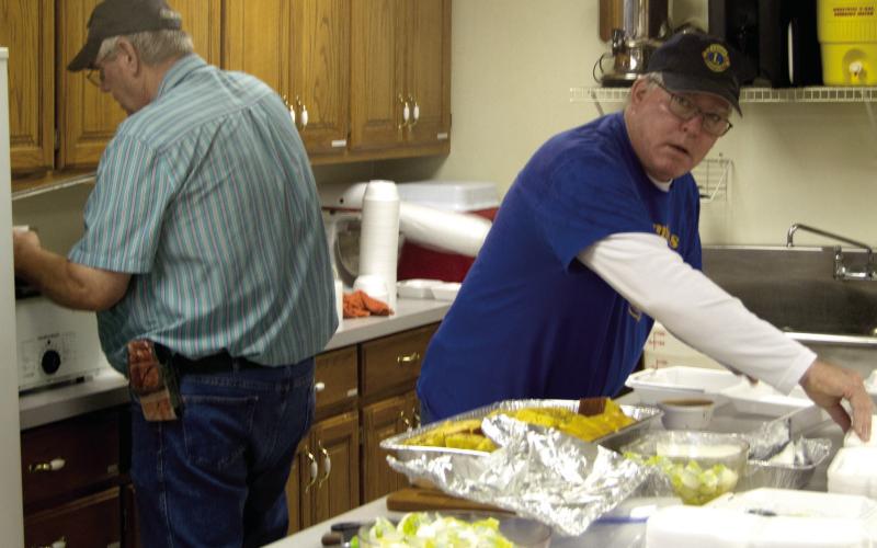 Lions Club members Brad Gleason and Mark Winter were busy preparing the meal served at the Lions Club vegetable soup and bean feed. The event was held at the St. Rose Parish Hall on Thursday at noon and evening.