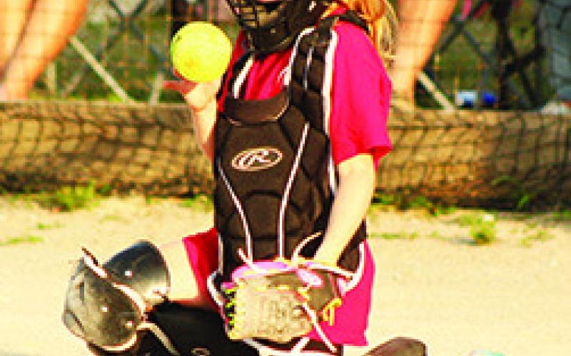 Jasmine Winninger, gets a turn behind the plate in the final Columbus Girls Softball League, eight and under game against Galena, Friday, at the Community Field Ball Park. Columbus took the win, 16-3.