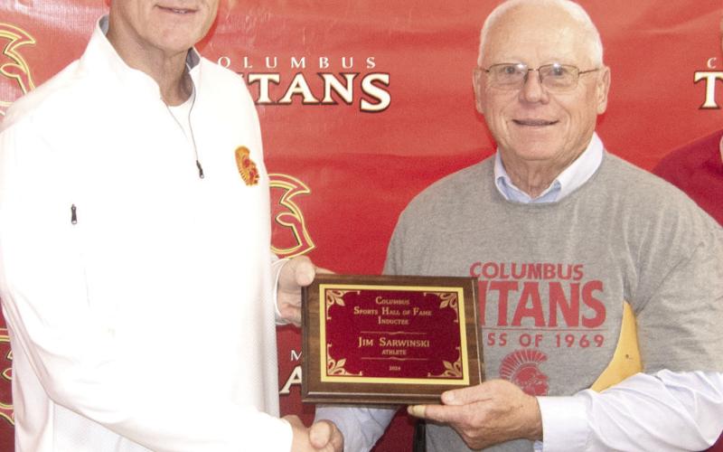 Hall of Fame Chairman Kerry Sachetta presented inductee Jim Sarwinski his plaque during the ceremony.