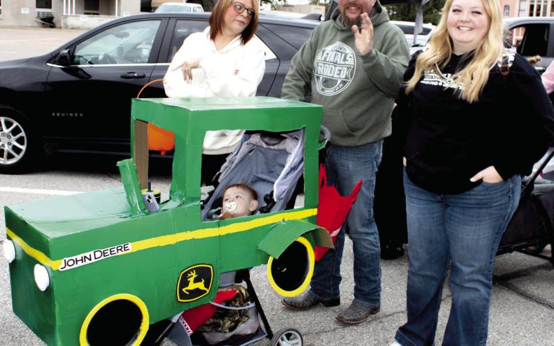 “Nothing runs like a Deere”, even during the Halloween Walk in Columbus. Ally Wells’ stroller was decorated just like a John Deere Tractor. Her youngster was enjoying his time in the driver’s seat.