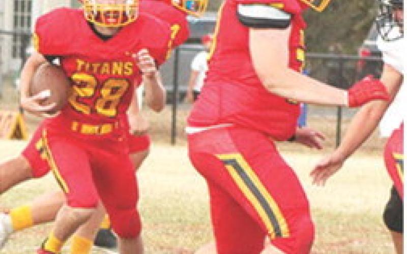 Titan Freshman, Brody Carter, scored two touchdowns including a kickoff return for a touchdown to start the second half to put the home team on top, 12-7, in the 30-21, Columbus win at Titan Stadium, Monday.