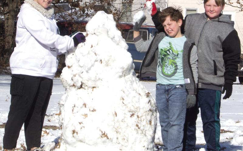 With the weekend snow came snowmen. Three youngsters built two snowmen on Maple Avenue Saturday. They are Zoey Clark, Brodie Robinson and Sully Clark.