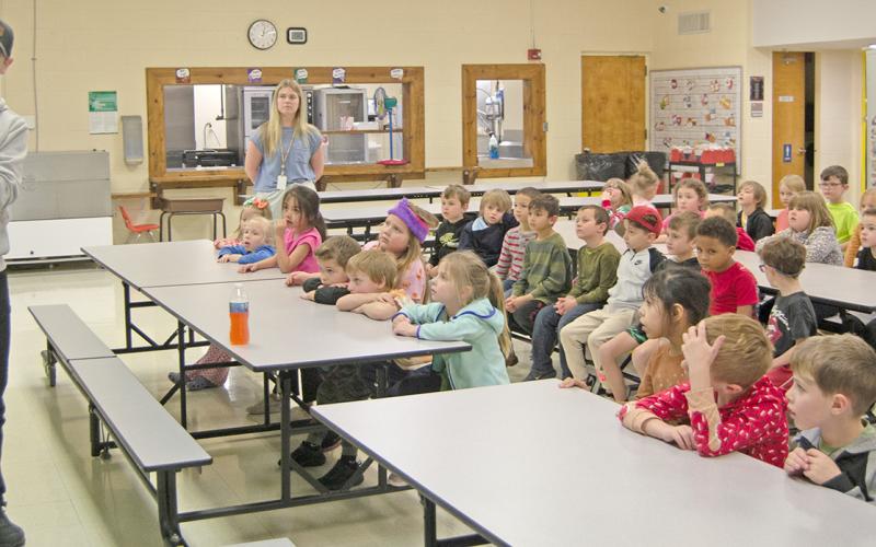 Park Elementary kindergarteners enjoy some afternoon reading time with Fire Chief, Steven Burton. Chief Burton read, “If You Give A Dog A Donut”, to kindergarten students during their readathon week celebrating Dr. Suess’ birthday. News Report photo by Tanya Woolsey.