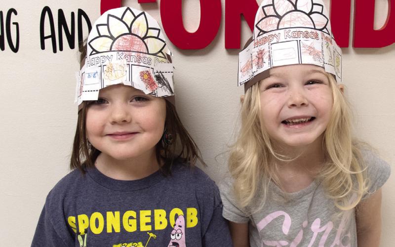 Youngsters at Columbus schools recently celebrated Kansas Day. Olivia Meredith and Hattie Napier created sunflower hats to recognize the state flower.