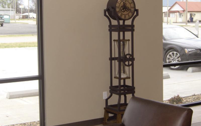 Clocks abound in the new American Bank building as many as five clocks are visible, bringing to mind the old saying “it’s time to save.”