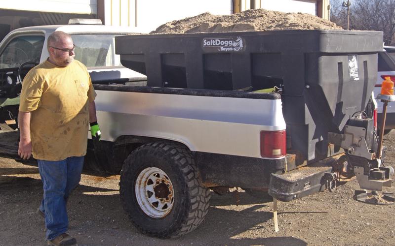 With the likelihood of severe winter weather on the near horizon, Columbus City crews are getting their equipment ready for service. James Reeves was getting ready to install snowplows to the trucks. The sanding mixture is already loaded and ready. News Report photo by Shawn Churchill.