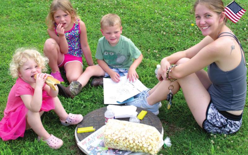 Part of the fun of the Fourth of July is a picnic in the park. Saturday the Baxter Springs Fire Department furnished hot dogs for the kids and the city provided the table disguised as a man hole cover. The family includes Juliette Hunt, 3; Carroline Hunt, 6; Franklin Hunt, 4; and Amber Hunt.
