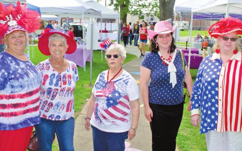 The Red Hat Society of the Four States were in the Baxter Springs parade and touring the festival Saturday morning. All decked out in their Fourth of July finery and red hats. They are Jean Neal, Kathy Wilkerson, Bonnie Adams, Gabrielle Jones and Cheryl Haggard. The pink hat indicates a member under the age of 50.