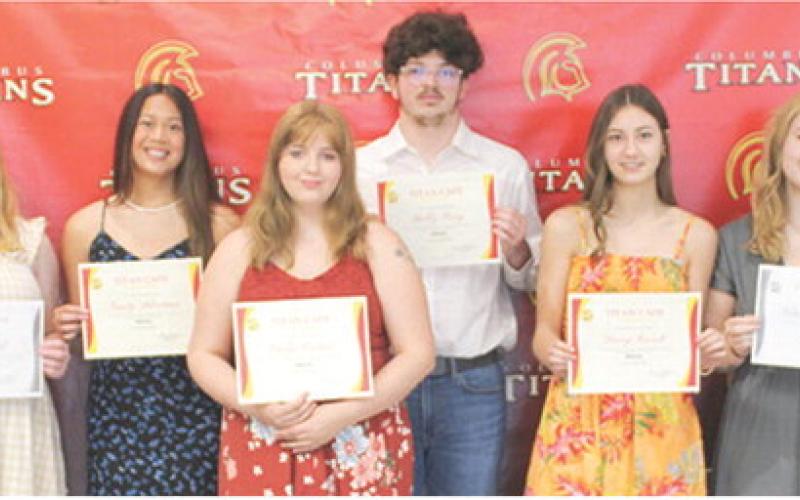 Laura Boeckman presented the Titan Cafe Scholarships to seven seniors who worked in the cafe throughout the school year and in some cases, two years as reflected in the amount of the award . Graci Hall, $800; Trinity Adoremos, $400; Emily Forkner, $400; Bobby Perry II, $400; Darcy Garrett, $400; Natalie Edmondson, $800; and Lemmie Stone, $400 each received the award during the May 15 Senior Assembly at the Columbus Unified High School Gymnasium.