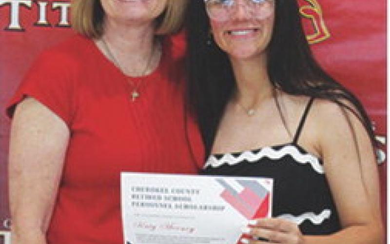Katy Mooney received a $400 scholarship from the Cherokee County Retired School Personnel from Regina Jameson during the 2025 Senior Assembly, May 16, at the CUHS Gymnasium.
